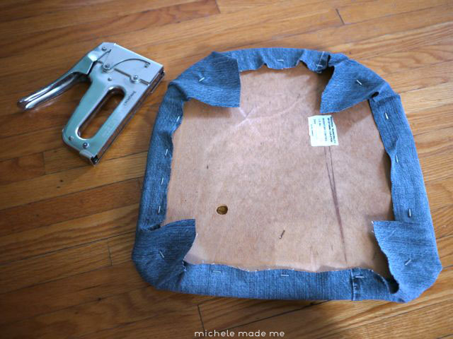 Stapling denim onto chair cushion Michele Made Me