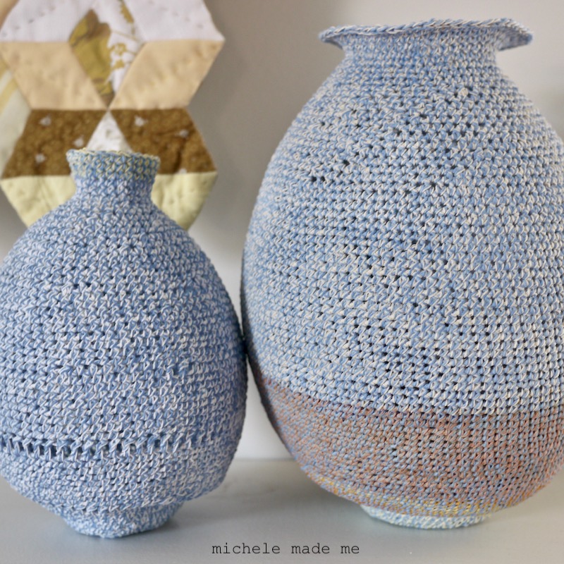 Two crocheted pots closeup.